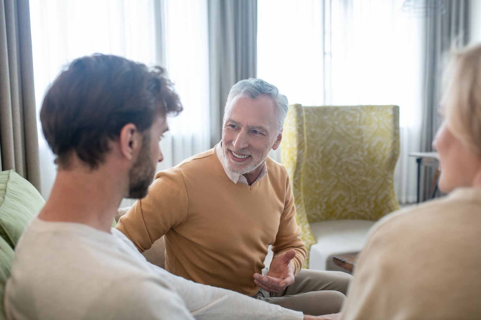 Son visiting his parents and talking to them